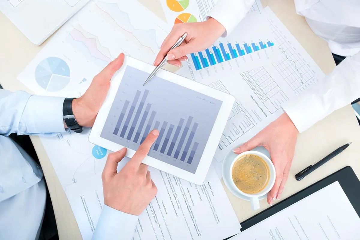 looking at charts and graphs, IRS conducts financial analysis
